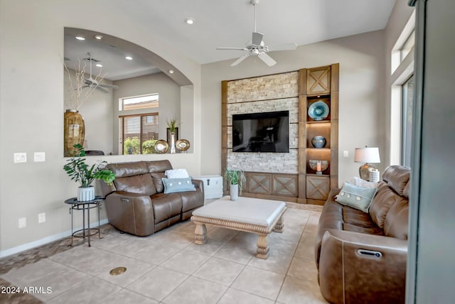 living room with light tile patterned flooring and ceiling fan