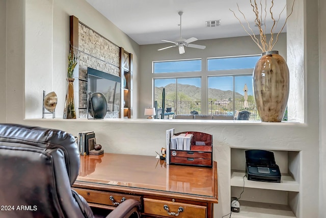 office area featuring a mountain view and ceiling fan