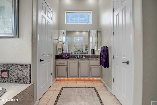 bathroom featuring tile patterned flooring and vanity