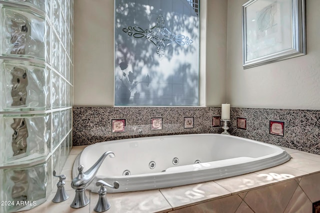 bathroom featuring tiled bath