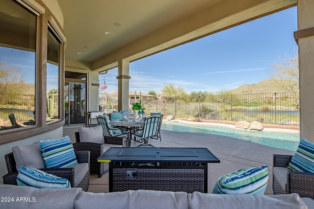 view of patio / terrace featuring a fenced in pool and outdoor lounge area