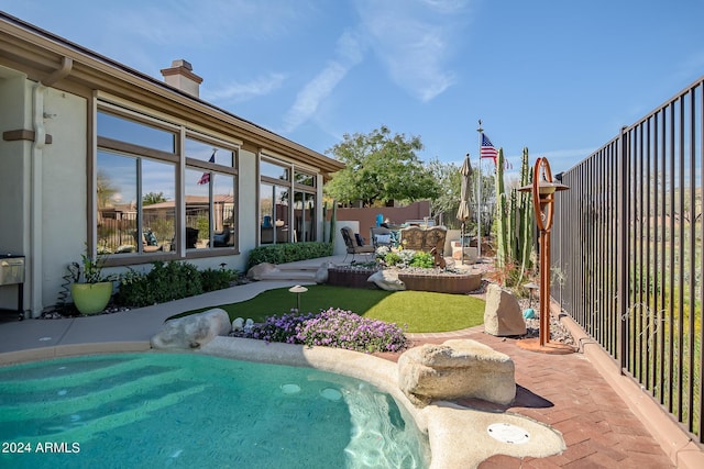 view of swimming pool with a patio