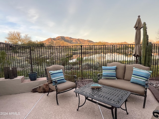 patio terrace at dusk with a mountain view