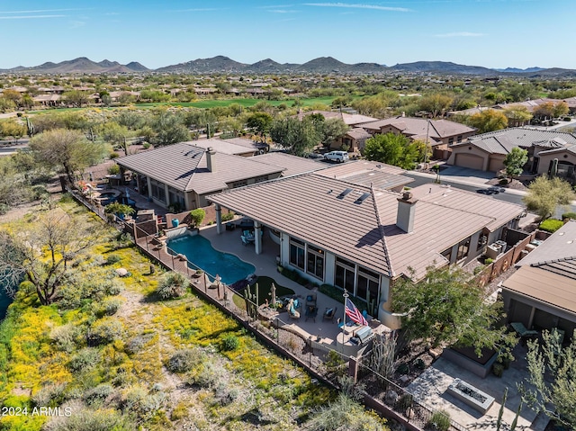 birds eye view of property featuring a mountain view