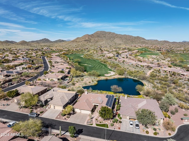 drone / aerial view featuring a water and mountain view