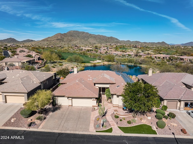 bird's eye view with a water and mountain view