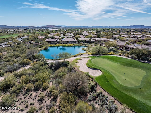 birds eye view of property with a water and mountain view