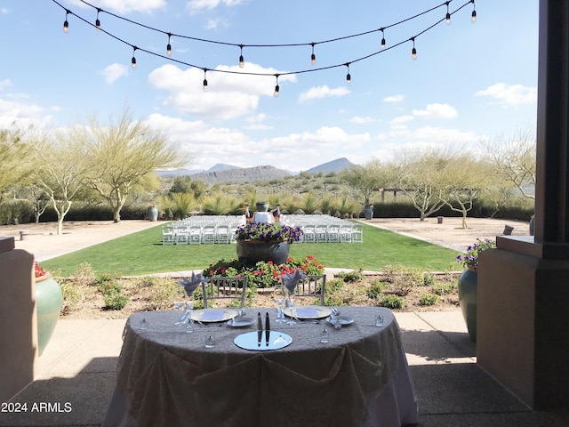 view of yard with a mountain view and a patio