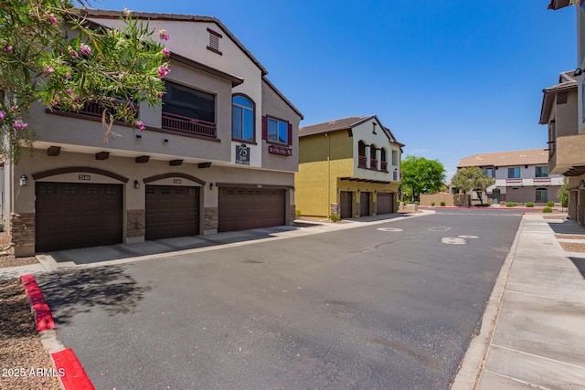 2725 E Mine Creek Rd Unit 1149, Phoenix, AZ 85024 - view of asphalt road featuring curbs and a residential view