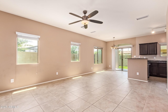 2725 E Mine Creek Rd Unit 1149, Phoenix, AZ 85024 - kitchen featuring light tile patterned floors, healthy amount of natural light, ceiling fan, and a chandelier