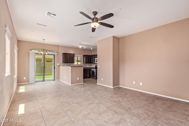 2725 E Mine Creek Rd Unit 1149, Phoenix, AZ 85024 - unfurnished living room featuring light tile patterned floors, a chandelier, ceiling fan, and rail lighting