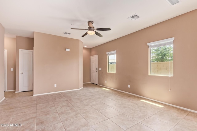 2725 E Mine Creek Rd Unit 1149, Phoenix, AZ 85024 - spare room with a ceiling fan and light tile patterned floors