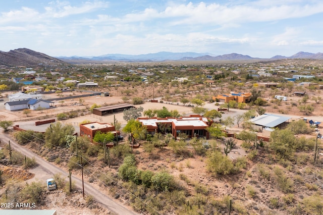 birds eye view of property with a mountain view