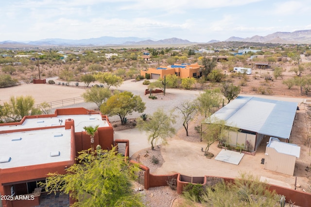 birds eye view of property with a mountain view