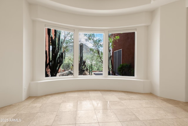 unfurnished room with tile patterned flooring