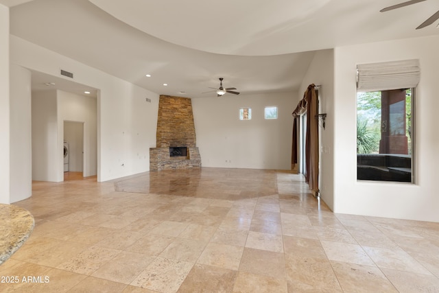 unfurnished living room with visible vents, a ceiling fan, a wealth of natural light, and recessed lighting