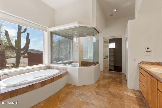 full bath featuring a bath and vanity