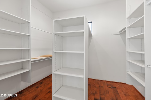 spacious closet with wood finished floors