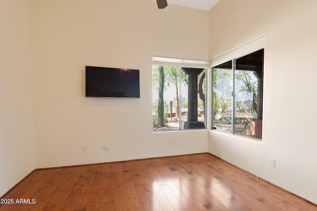 spare room featuring ceiling fan and wood finished floors