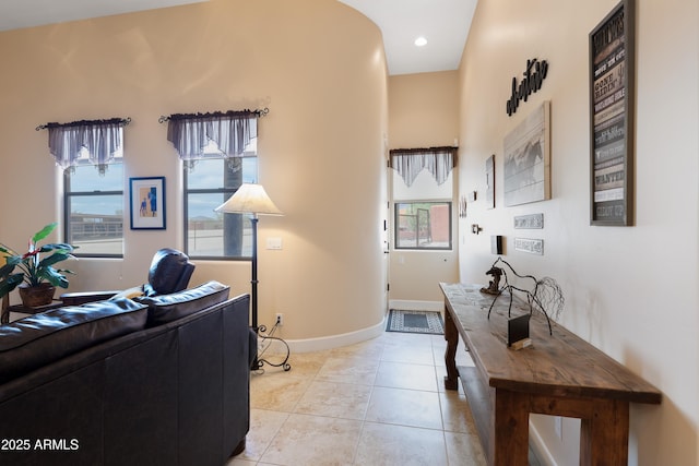 home office featuring baseboards, light tile patterned floors, and a wealth of natural light