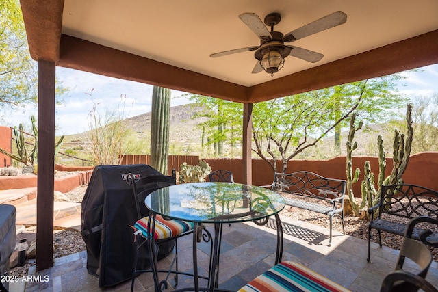 view of patio / terrace featuring outdoor dining area, a fenced backyard, ceiling fan, and a grill