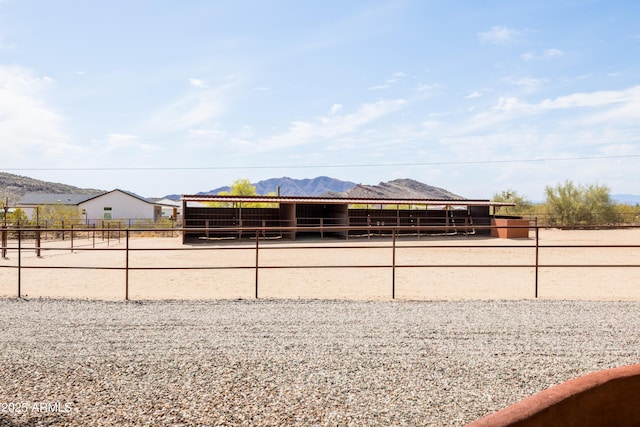 view of property's community featuring an outdoor structure, an exterior structure, and a mountain view