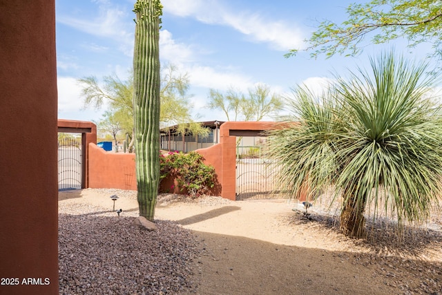 view of yard featuring a gate and fence