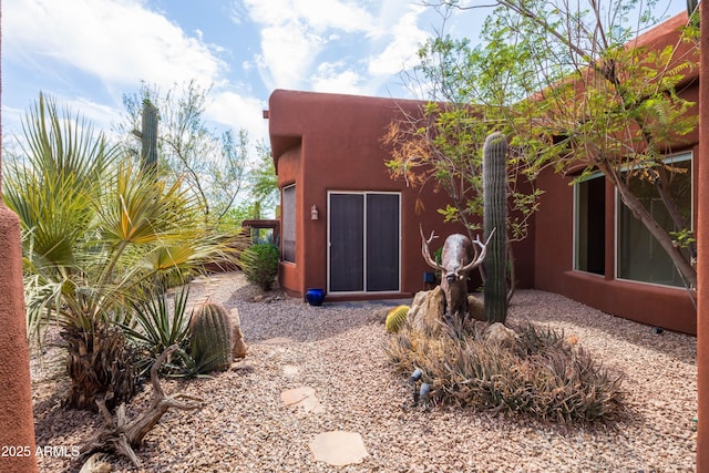 exterior space featuring stucco siding