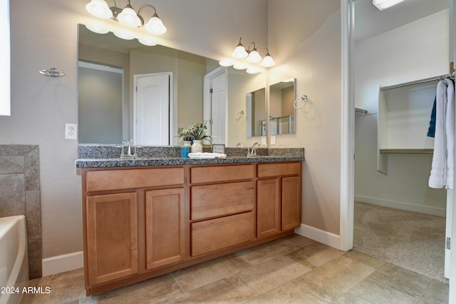 bathroom featuring a tub and vanity