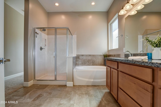 bathroom with plus walk in shower and vanity