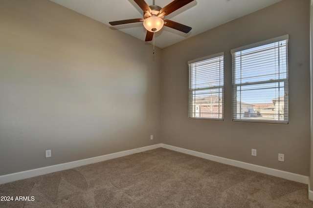 spare room featuring carpet and ceiling fan