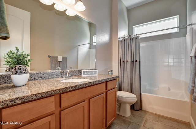 full bathroom featuring toilet, tile patterned floors, vanity, and shower / tub combo with curtain