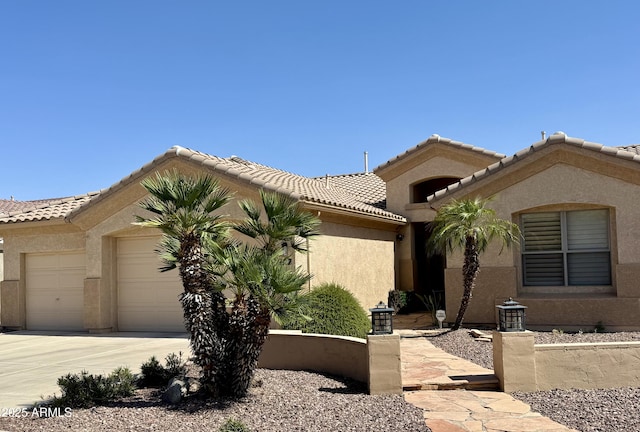 2069 E Winchester Way, Chandler, AZ 85286 - view of front facade with a garage, driveway, stucco siding, and a tiled roof