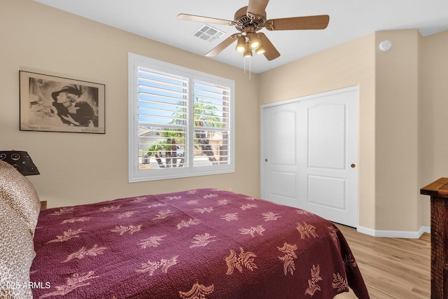 2069 E Winchester Way, Chandler, AZ 85286 - bedroom with light wood-style flooring, a ceiling fan, and a closet