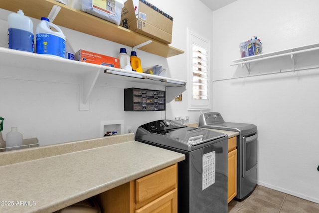 2069 E Winchester Way, Chandler, AZ 85286 - laundry area featuring washer and clothes dryer, light tile patterned floors, and cabinet space