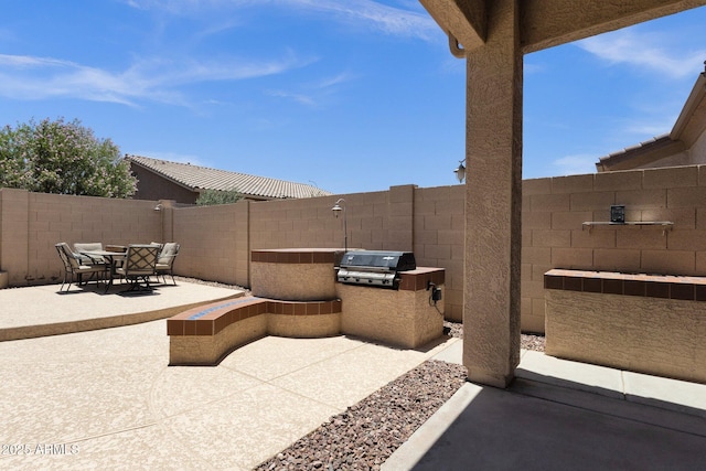 2069 E Winchester Way, Chandler, AZ 85286 - fenced backyard with a patio area, area for grilling, and outdoor dining area
