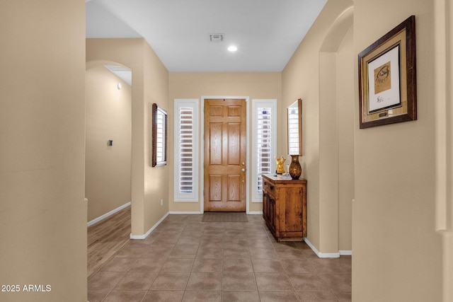 2069 E Winchester Way, Chandler, AZ 85286 - foyer entrance with arched walkways and light tile patterned floors