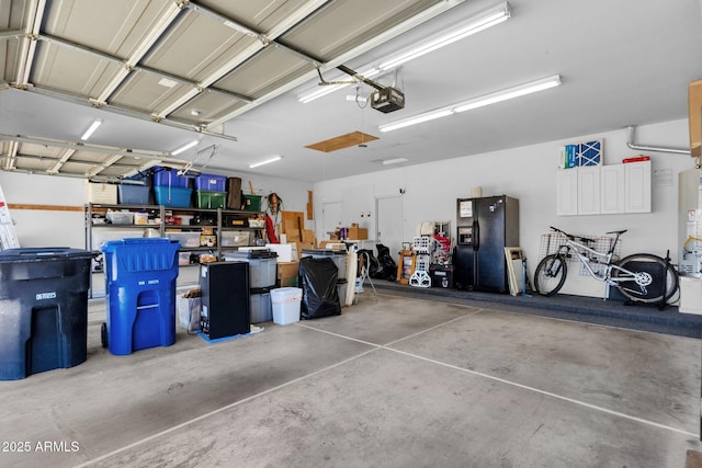 2069 E Winchester Way, Chandler, AZ 85286 - garage featuring black fridge with ice dispenser, a garage door opener, and water heater