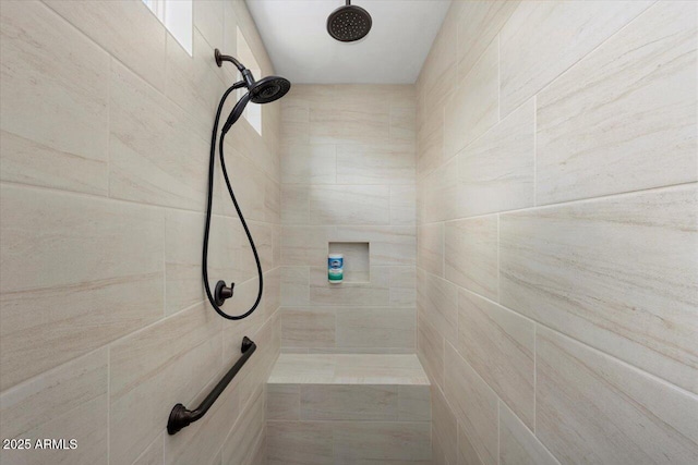 full bath featuring a tile shower