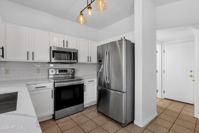 2545 E Harrison Ct, Gilbert, AZ 85295 - kitchen featuring appliances with stainless steel finishes, white cabinetry, light tile patterned flooring, and decorative backsplash
