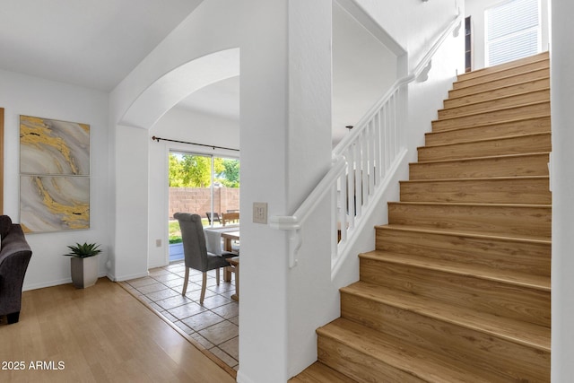 2545 E Harrison Ct, Gilbert, AZ 85295 - stairway featuring arched walkways and wood finished floors