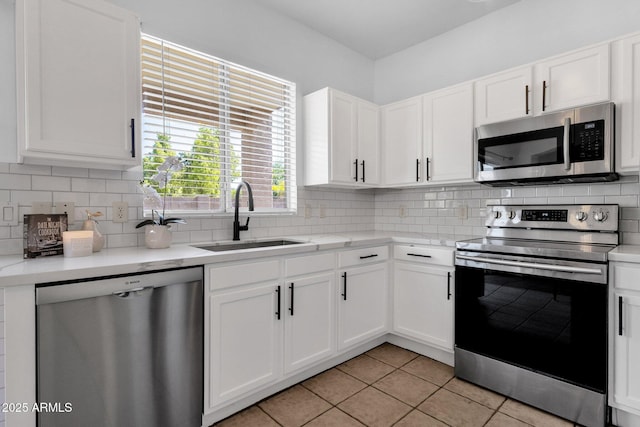 2545 E Harrison Ct, Gilbert, AZ 85295 - kitchen featuring appliances with stainless steel finishes, light countertops, white cabinetry, and light tile patterned floors