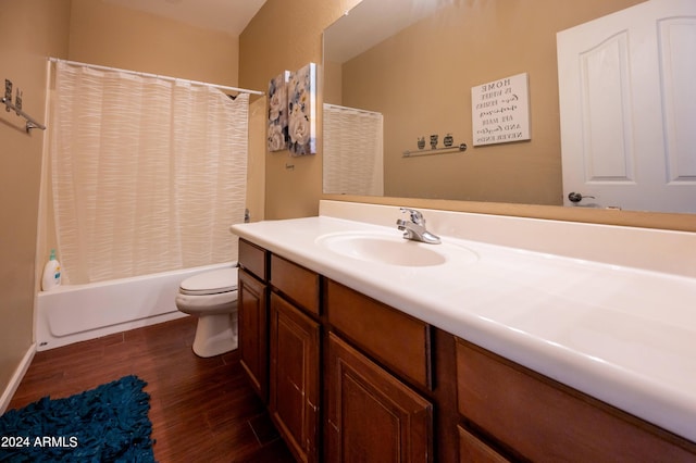 full bathroom with vanity, toilet, wood-type flooring, and shower / bath combo with shower curtain