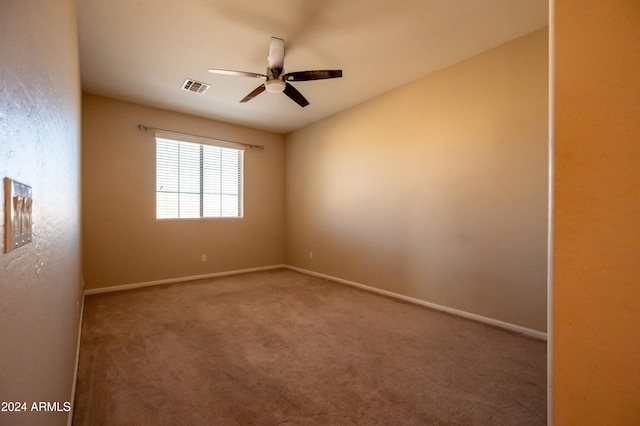 carpeted empty room with ceiling fan