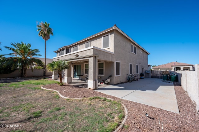 back of house with a patio area