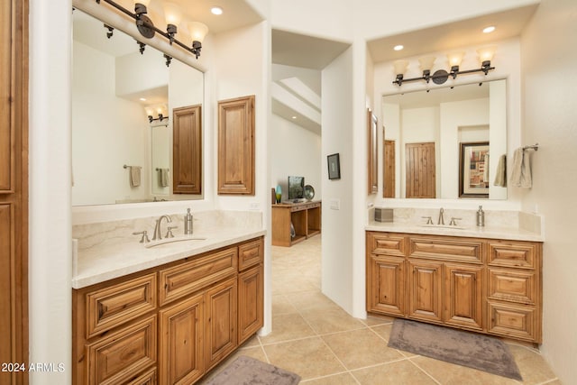 bathroom with tile patterned flooring and vanity