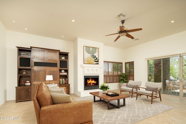 living room featuring ceiling fan and light tile patterned flooring