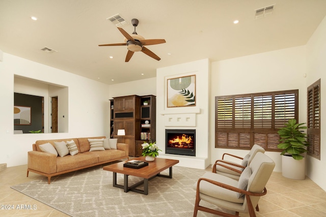 tiled living room with ceiling fan