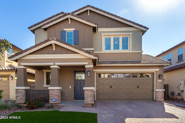 craftsman-style home with a garage