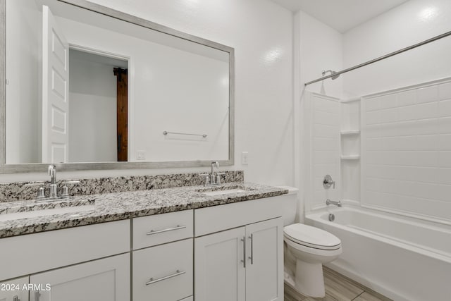 full bathroom with shower / bathing tub combination, vanity, and toilet